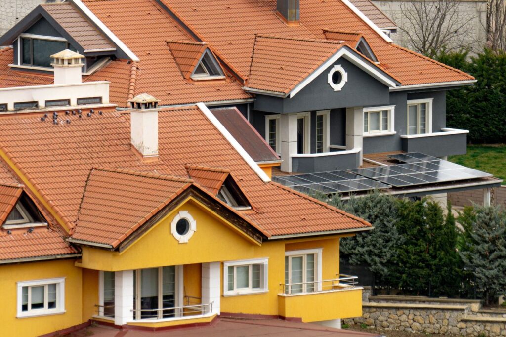A picturesque view of colorful homes in Ankara, Türkiye, with solar panels and modern architecture.